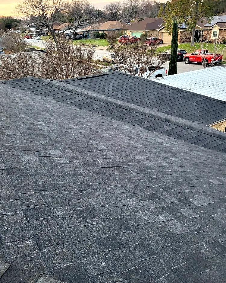 Charcoal architectural shingle roof in a Fort Worth neighborhood
