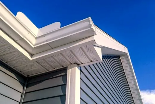 White seamless aluminum gutters on a home's roofline